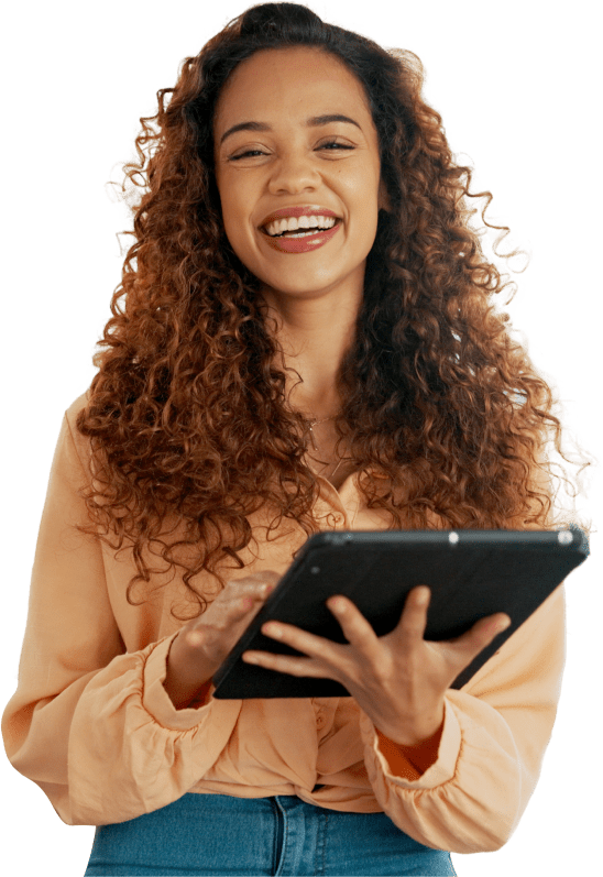 Woman smiling, holding tablet, curly hair.