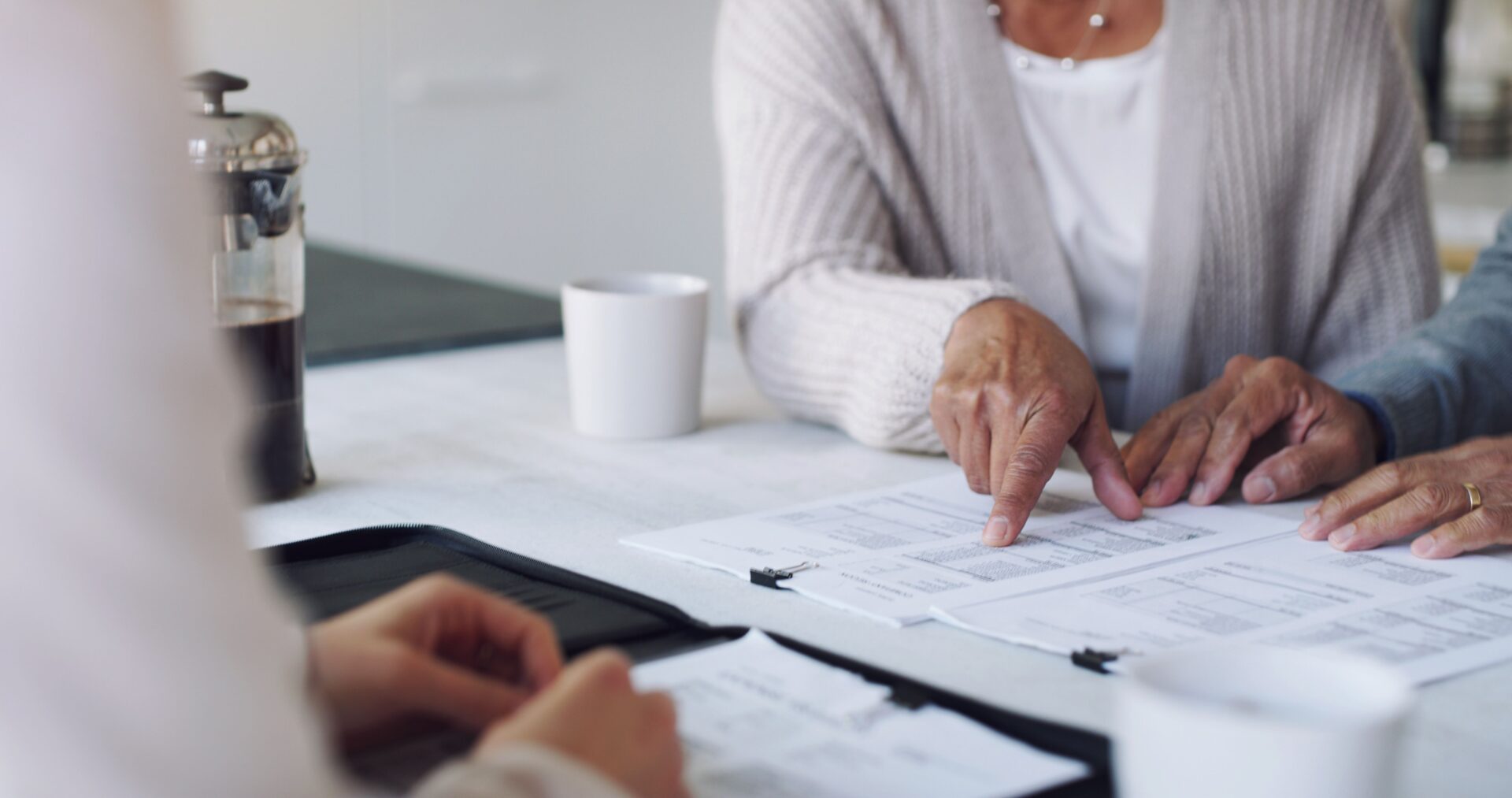 Senior couple reviewing paperwork together.